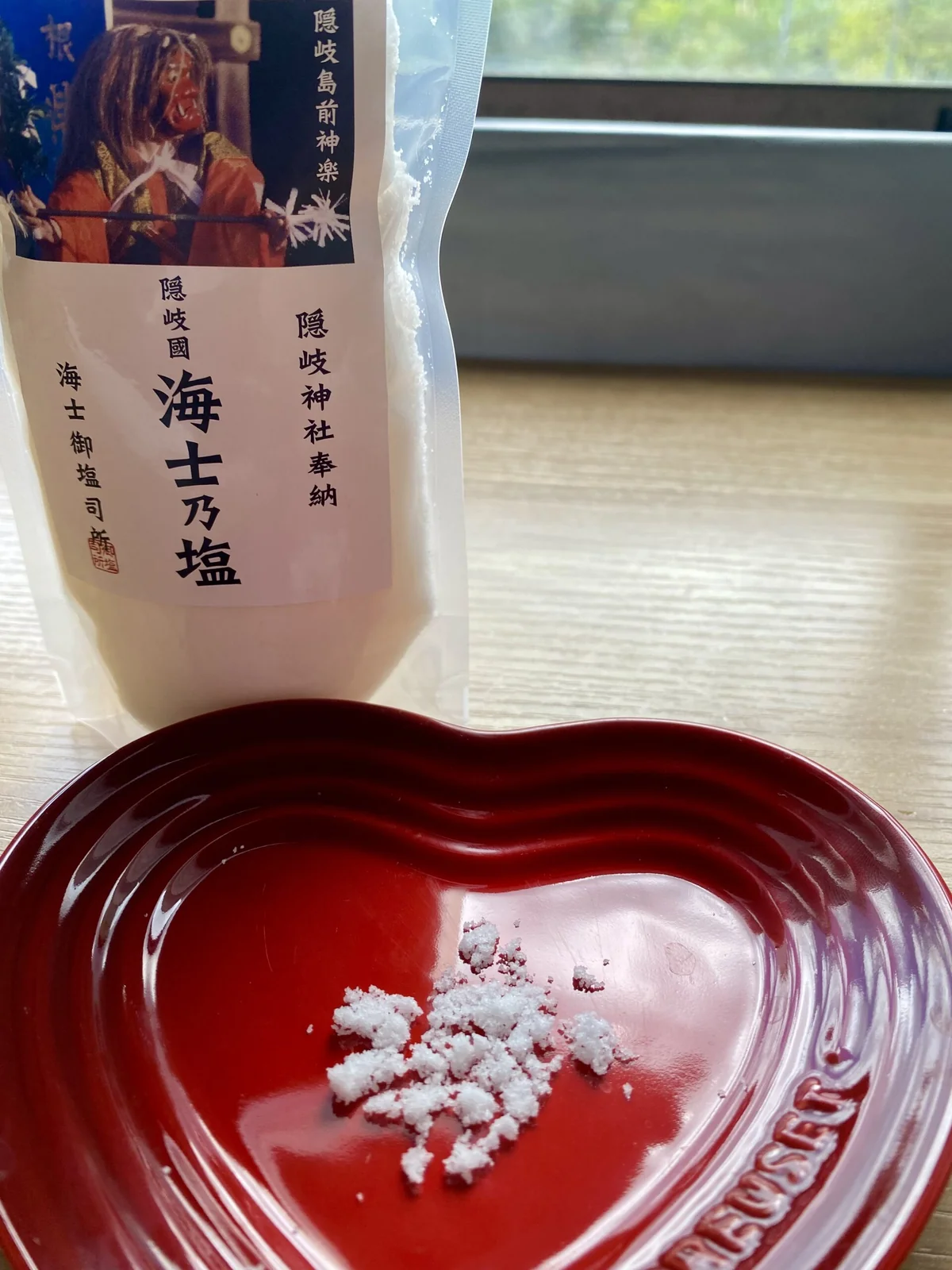 Ama no Shio Japanese sea salt with salt crystals in a small red dish